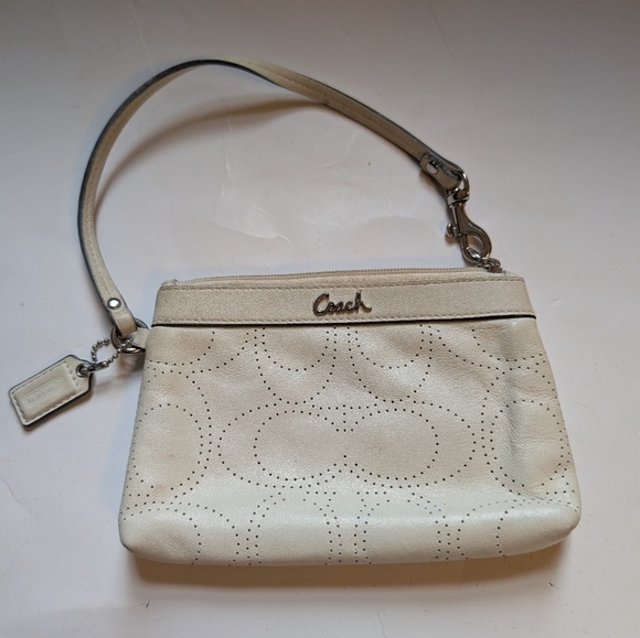 Coach Handbags - Coach perforated logo leather wristlet in a off-white color in VGUC